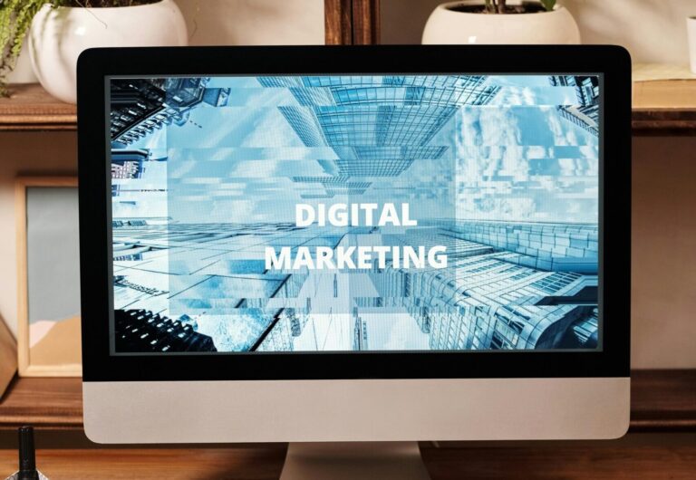 Contemporary office setup featuring digital marketing strategy on a computer screen, ideal for business technology themes.